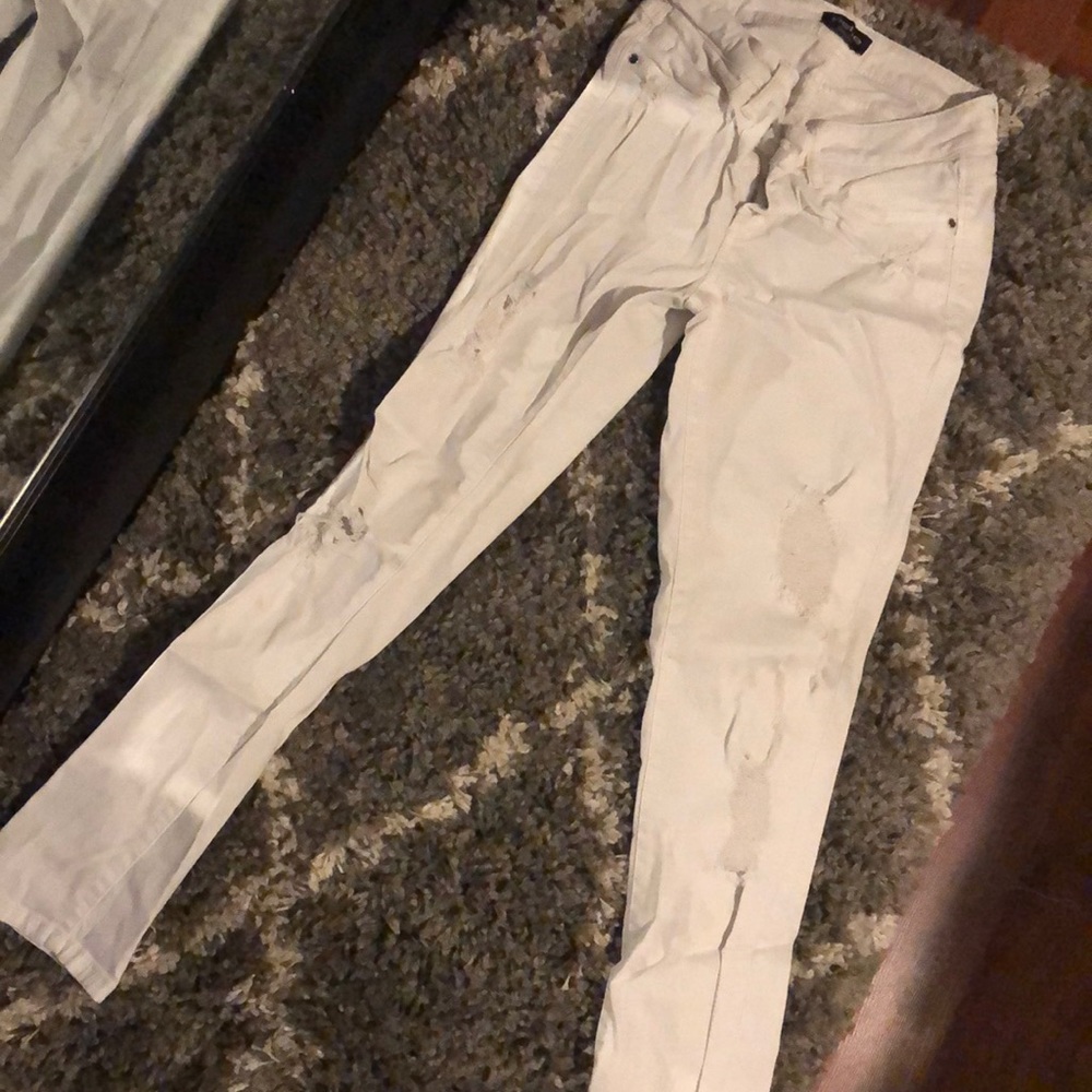 Distressed white jeans